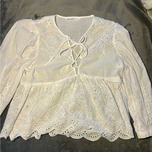 A Small flowy white long sleeve from Zara! Would be perfect for a vacation🤍